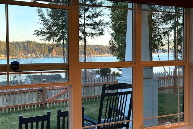 81 E Sullivan St, Allyn, WA 98524 - doorway to outside with a water view, a view of trees, and plenty of natural light
