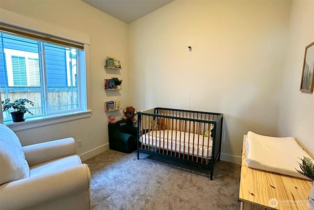 81 E Sullivan St, Allyn, WA 98524 - carpeted bedroom with baseboards and a nursery area