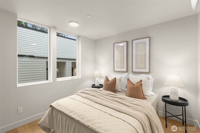 1108B 34th Ave, Seattle, WA 98122 - bedroom featuring baseboards and wood finished floors