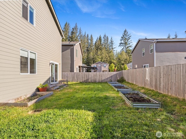 12029 317th Dr SE, Sultan, WA 98294 - fenced backyard with a garden