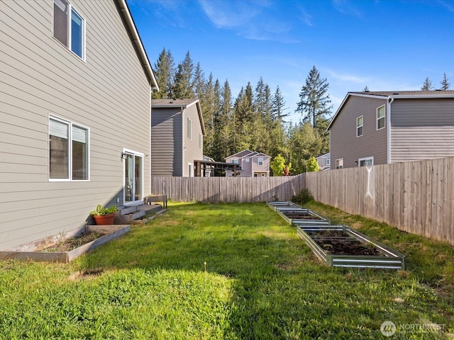 12029 317th Dr SE, Sultan, WA 98294 - fenced yard with a vegetable garden