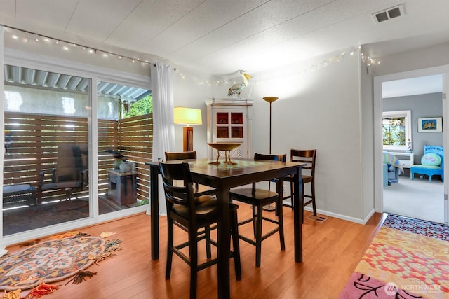 4111 164th St SW Unit 2, Lynnwood, WA 98087 - dining space featuring wood finished floors and track lighting