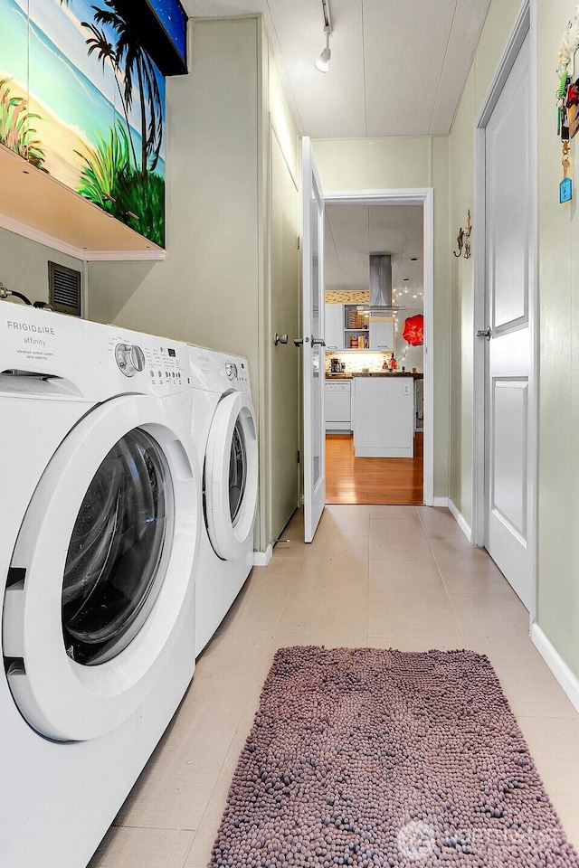 4111 164th St SW Unit 2, Lynnwood, WA 98087 - washroom with separate washer and dryer and rail lighting