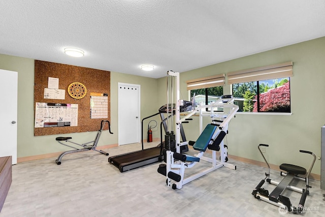 4111 164th St SW Unit 2, Lynnwood, WA 98087 - exercise area with baseboards and a textured ceiling