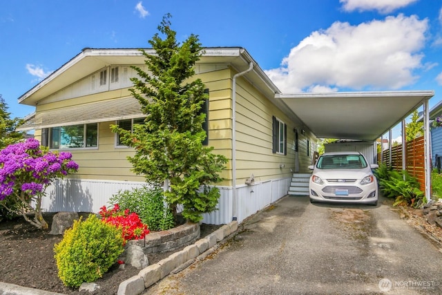 4111 164th St SW Unit 2, Lynnwood, WA 98087 - view of front of house featuring a carport and driveway