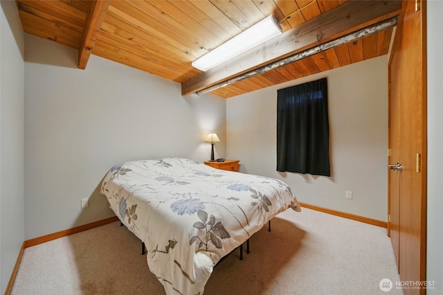 carpeted bedroom with wood ceiling, beamed ceiling, and baseboards