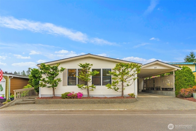 32820 20th Ave S Unit 47, Federal Way, WA 98003 - view of front of property featuring a carport and driveway