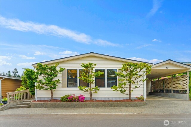32820 20th Ave S Unit 47, Federal Way, WA 98003 - view of front of house featuring a carport and asphalt driveway
