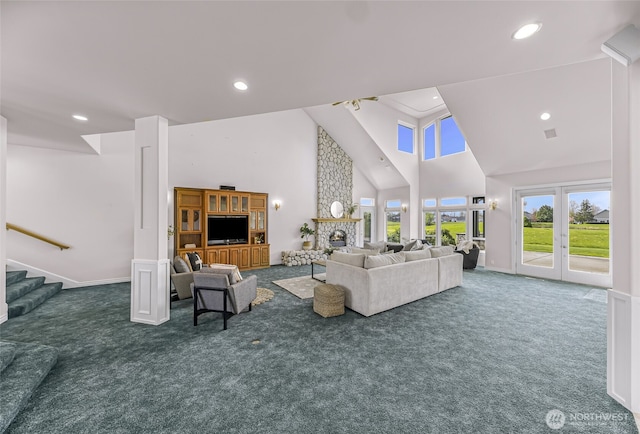 325 Island Green Way, Lynden, WA 98264 - carpeted living room with high vaulted ceiling, stairs, recessed lighting, and baseboards