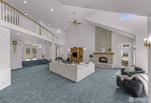 325 Island Green Way, Lynden, WA 98264 - carpeted living area featuring high vaulted ceiling, a fireplace, ceiling fan, and recessed lighting