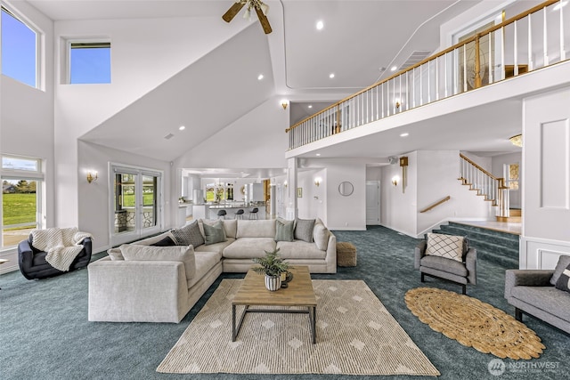 325 Island Green Way, Lynden, WA 98264 - living room featuring a high ceiling, carpet, stairway, healthy amount of natural light, and recessed lighting