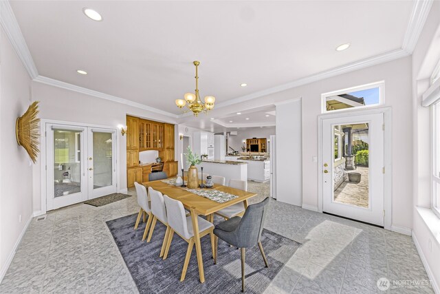 325 Island Green Way, Lynden, WA 98264 - dining space with a chandelier, french doors, baseboards, crown molding, and recessed lighting