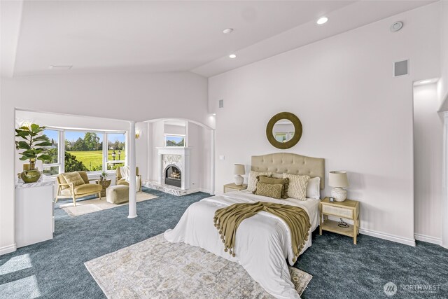 325 Island Green Way, Lynden, WA 98264 - bedroom with carpet, a fireplace, high vaulted ceiling, arched walkways, and baseboards