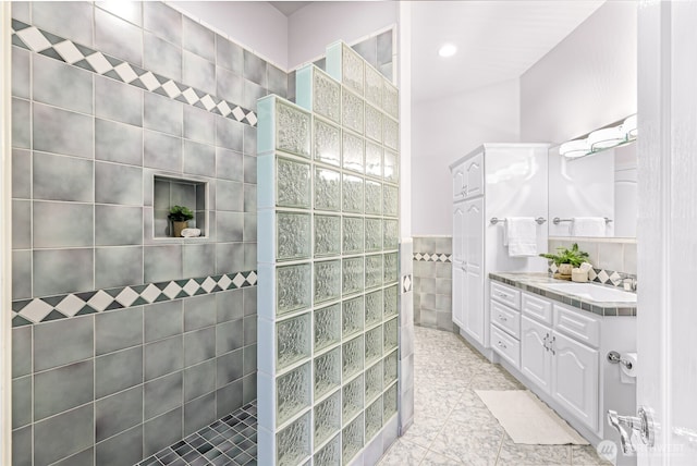 325 Island Green Way, Lynden, WA 98264 - full bath featuring a walk in shower, vanity, tile walls, and tile patterned floors