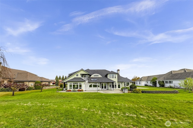 325 Island Green Way, Lynden, WA 98264 - back of house with a yard, a patio, and a chimney