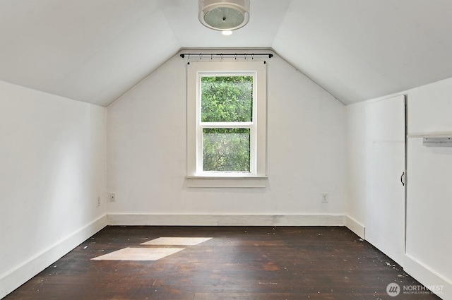 bonus room featuring hardwood / wood-style flooring, lofted ceiling, and baseboards