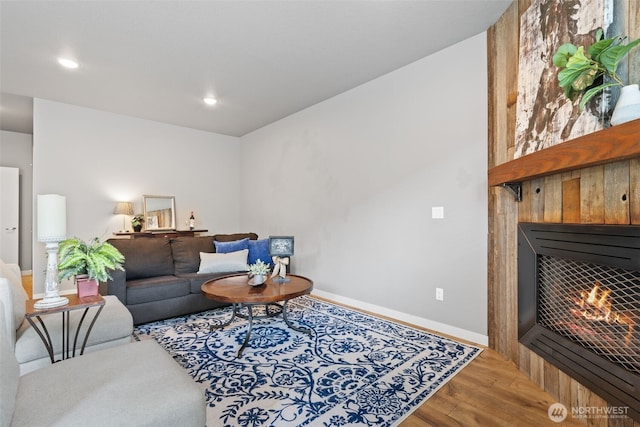 12313 NE 116th St N, Vancouver, WA 98682 - living area with wood finished floors, a tiled fireplace, baseboards, and recessed lighting