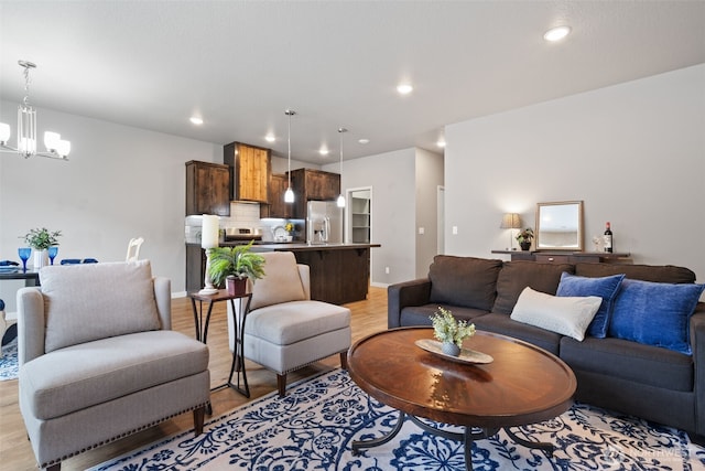 12313 NE 116th St N, Vancouver, WA 98682 - living room featuring a chandelier, light wood-style floors, recessed lighting, and baseboards