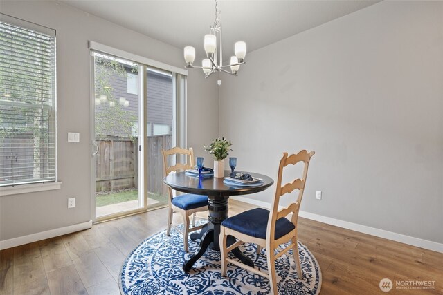 12313 NE 116th St N, Vancouver, WA 98682 - dining room featuring plenty of natural light, a chandelier, wood finished floors, and baseboards