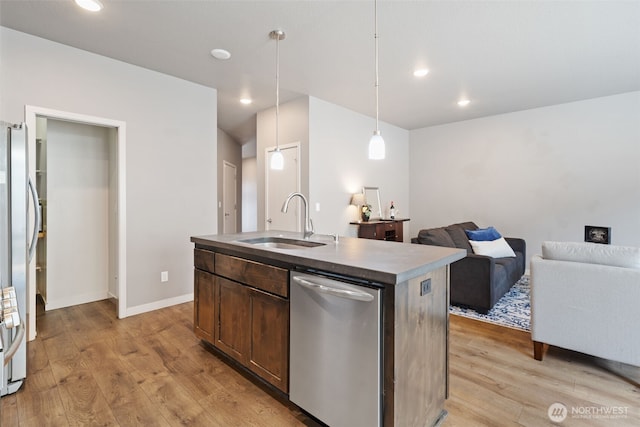 12313 NE 116th St N, Vancouver, WA 98682 - kitchen with appliances with stainless steel finishes, a sink, light wood-style floors, open floor plan, and recessed lighting