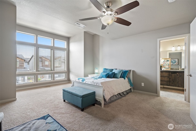 12313 NE 116th St N, Vancouver, WA 98682 - bedroom featuring carpet flooring, ceiling fan, a sink, connected bathroom, and baseboards