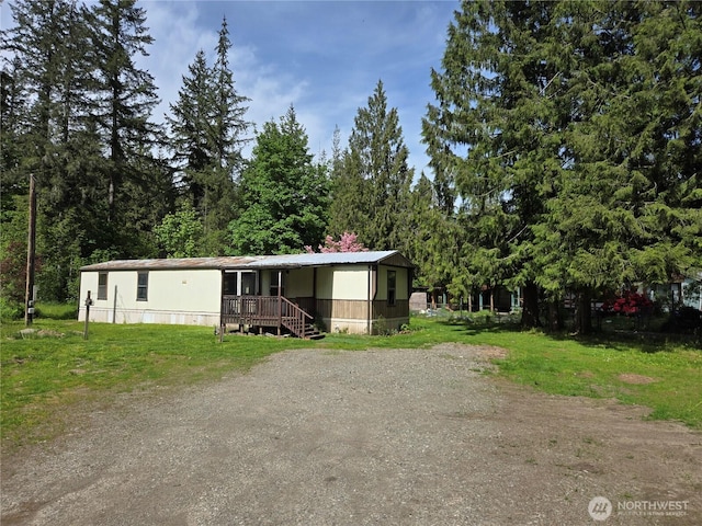 46400 Baker Loop Rd, Concrete, WA 98237 - manufactured / mobile home featuring covered porch and a front lawn