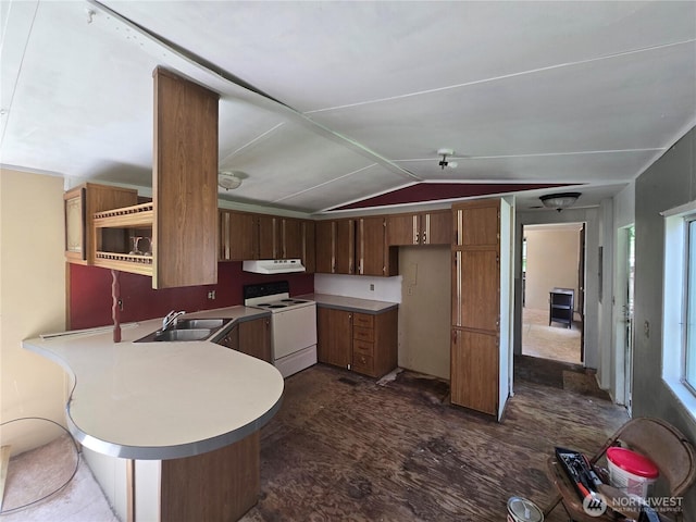 46400 Baker Loop Rd, Concrete, WA 98237 - kitchen featuring white range with electric stovetop, a peninsula, vaulted ceiling, light countertops, and under cabinet range hood