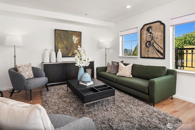 1125 E Olive St Unit 501, Seattle, WA 98122 - living room with wood finished floors, healthy amount of natural light, baseboards, and recessed lighting