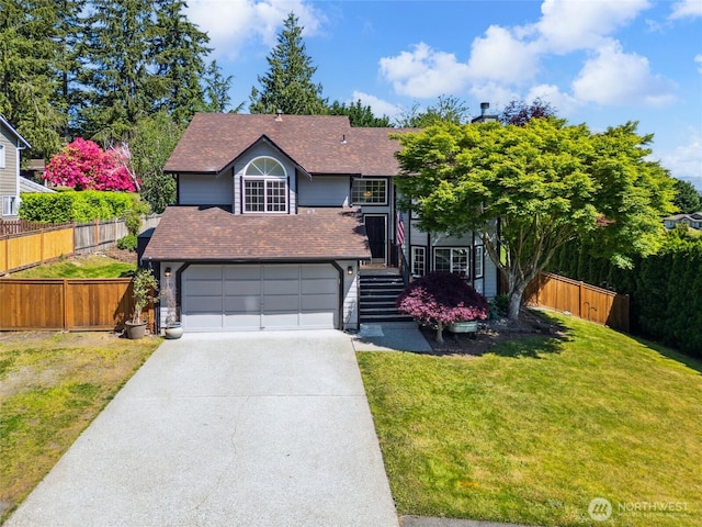 11929 25th St SE, Lake Stevens, WA 98258 - view of front facade with driveway, a shingled roof, and a garage