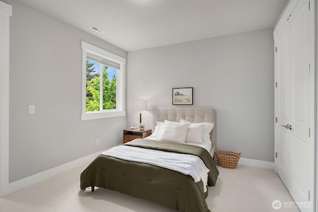 bedroom featuring carpet floors and baseboards