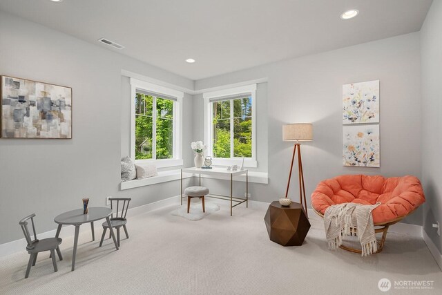 living area with carpet floors, baseboards, and recessed lighting