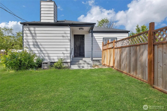 337 100th St S, Tacoma, WA 98444 - rear view of house featuring a chimney, entry steps, and roof with shingles