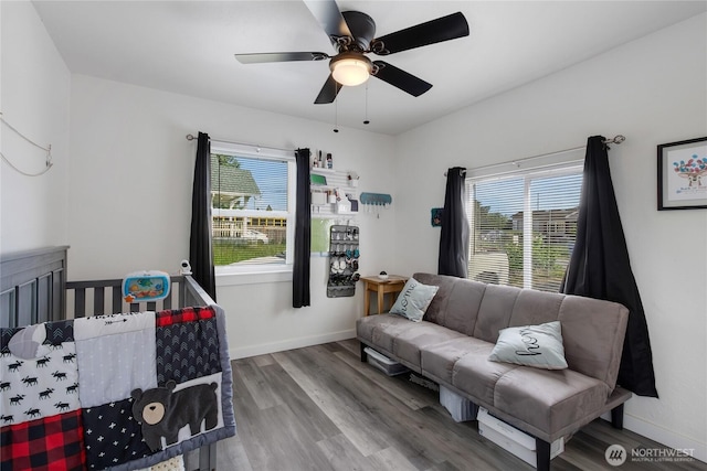 337 100th St S, Tacoma, WA 98444 - bedroom featuring multiple windows, wood finished floors, ceiling fan, and baseboards