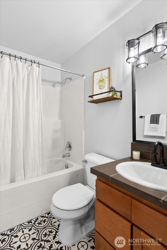 full bath with shower / tub combo with curtain, vanity, toilet, and tile patterned flooring