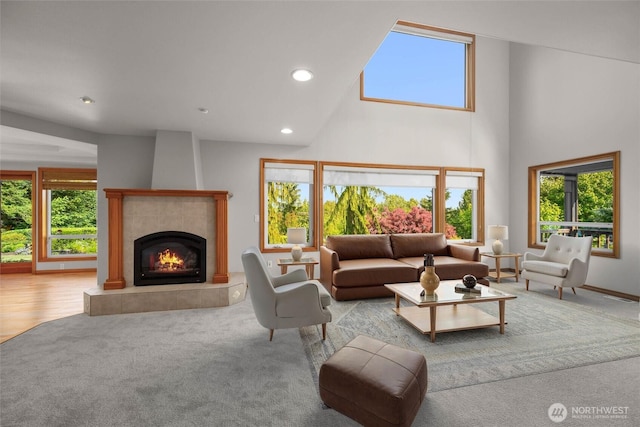 26901 15th Ave NE, Arlington, WA 98223 - living area featuring a fireplace, healthy amount of natural light, recessed lighting, high vaulted ceiling, and carpet