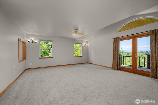 26901 15th Ave NE, Arlington, WA 98223 - carpeted empty room featuring ceiling fan, french doors, lofted ceiling, and a chandelier
