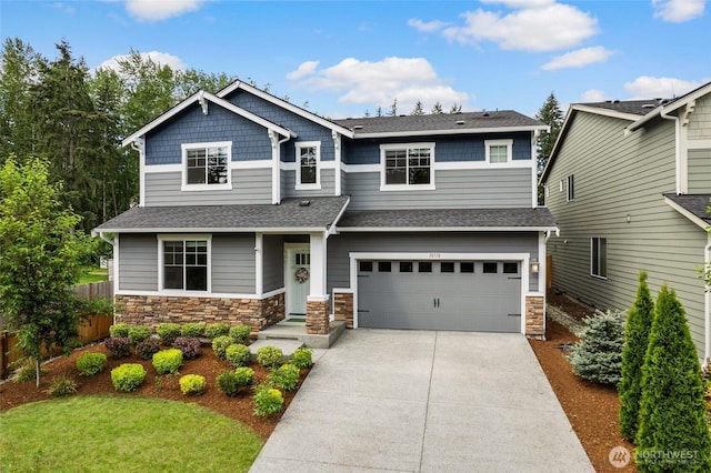 craftsman inspired home featuring roof with shingles, driveway, a garage, and stone siding