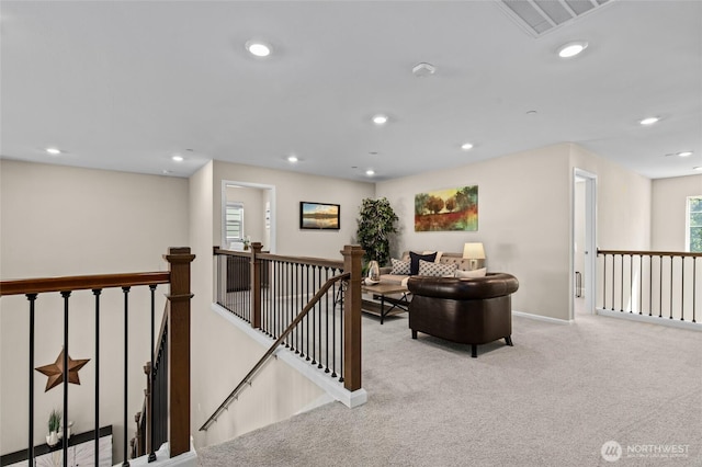 living room with carpet flooring, recessed lighting, and baseboards