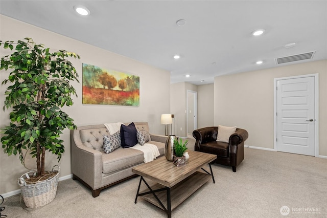 living room featuring light carpet, baseboards, and recessed lighting