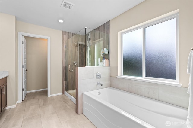 bathroom with vanity, a garden tub, a stall shower, baseboards, and recessed lighting