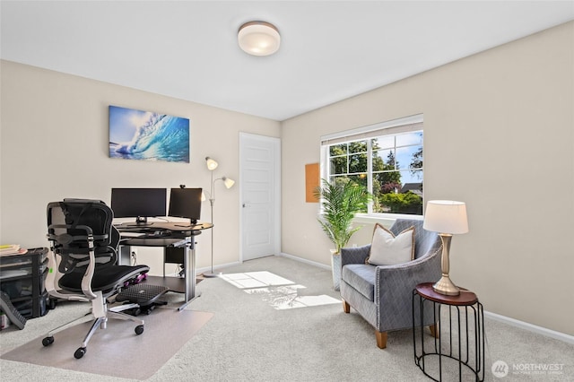 carpeted office featuring baseboards