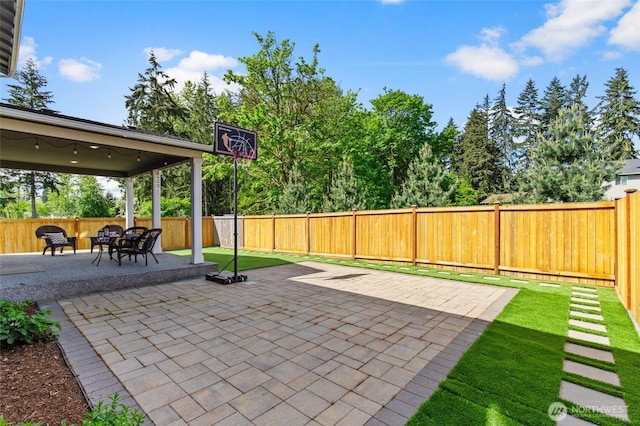 view of patio featuring a fenced backyard