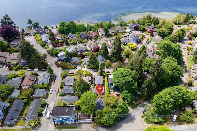 aerial view of residential area with a nearby body of water