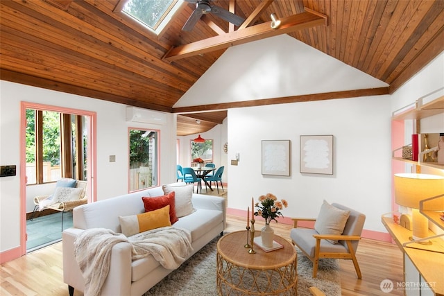 living area featuring a ceiling fan, wood ceiling, a wall unit AC, light wood-style flooring, and a skylight