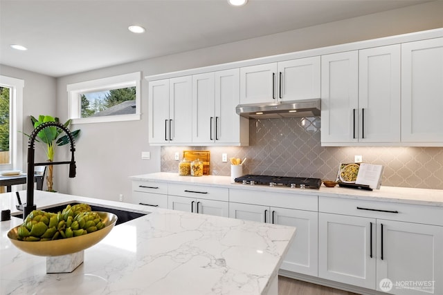 20022 7th Ave SE, Bothell, WA 98012 - kitchen with a sink, stainless steel gas stovetop, white cabinets, light stone counters, and recessed lighting
