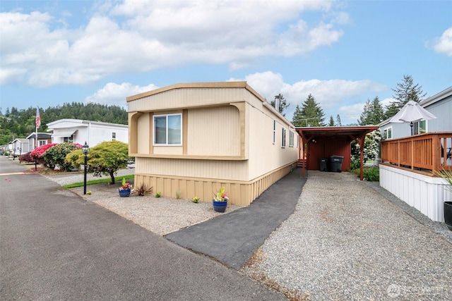 5705 113th Ave E Unit 68, Puyallup, WA 98372 - view of front facade featuring gravel driveway