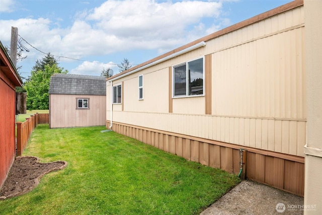 5705 113th Ave E Unit 68, Puyallup, WA 98372 - view of side of home featuring an outbuilding and a storage shed