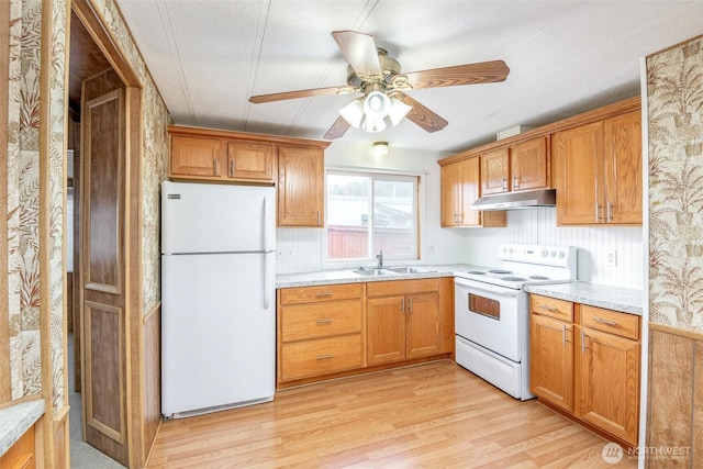 5705 113th Ave E Unit 68, Puyallup, WA 98372 - kitchen featuring white appliances, under cabinet range hood, a sink, a ceiling fan, and light countertops
