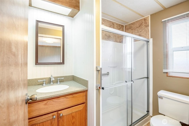 5705 113th Ave E Unit 68, Puyallup, WA 98372 - bathroom featuring toilet, a shower stall, and healthy amount of natural light