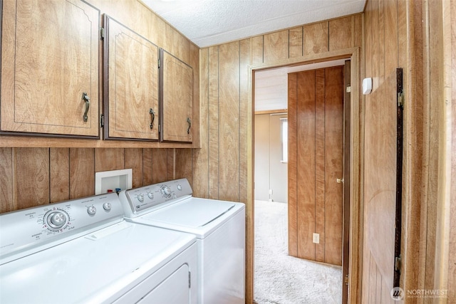 5705 113th Ave E Unit 68, Puyallup, WA 98372 - laundry area featuring cabinet space, washer and clothes dryer, wooden walls, carpet flooring, and a textured ceiling